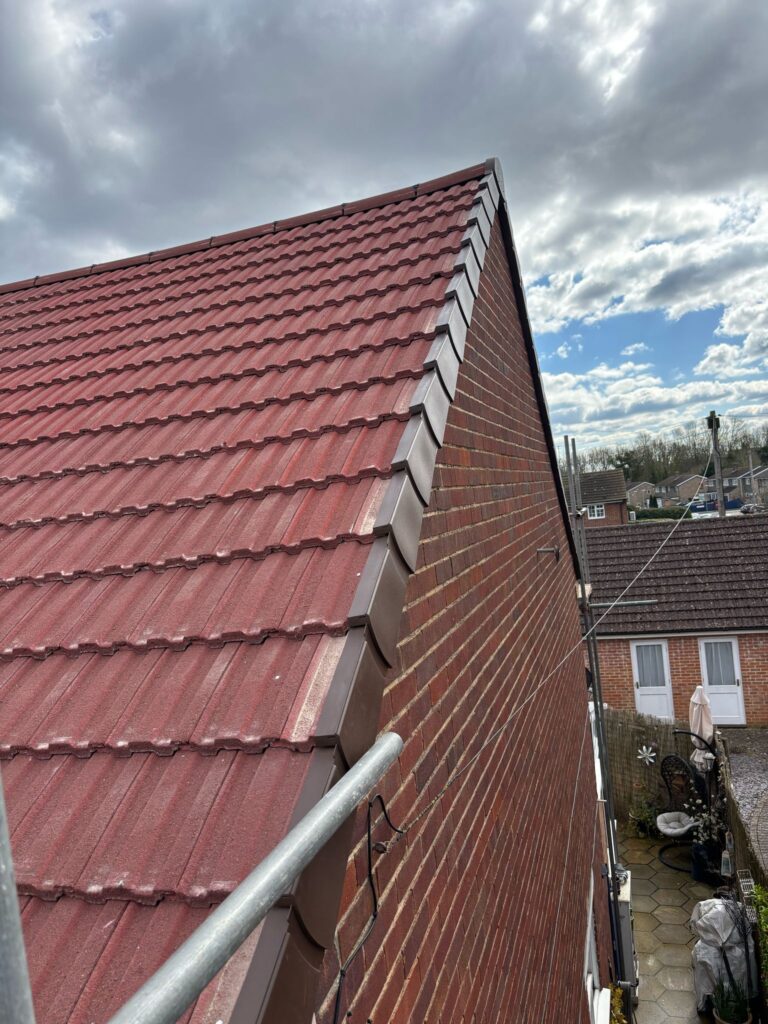This photo shows a roof in Kent before spray foam removal started.