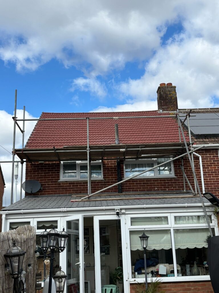 This photo shows a roof in Kent before spray foam removal started.